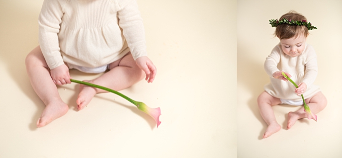baby photographers columbus ohio baby plays with a pink cala lily