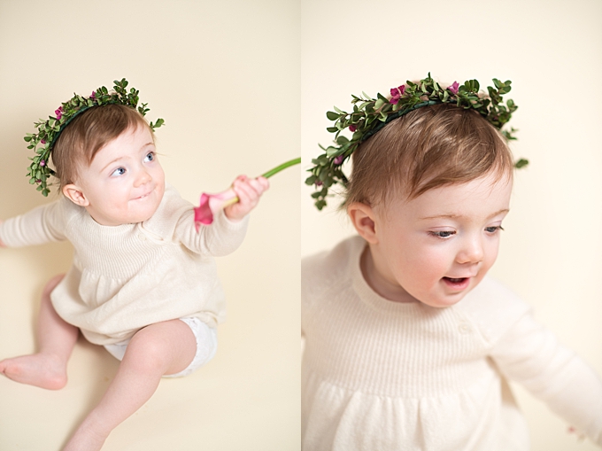 family photographers columbus ohio baby in flower crown playing with flowers