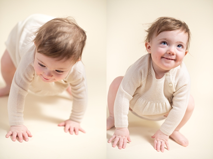 baby photographers columbus ohio baby crawling and getting ready to stand