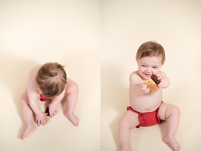 studio baby photography baby plays with christmas cookies