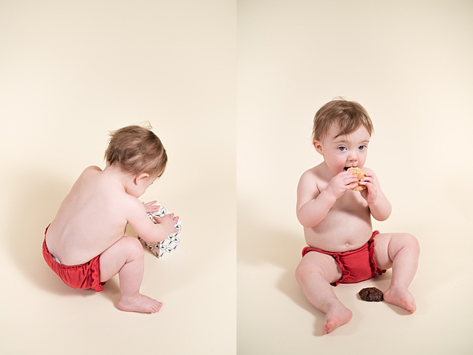 studio baby photography baby opens and eats Santa's cookies
