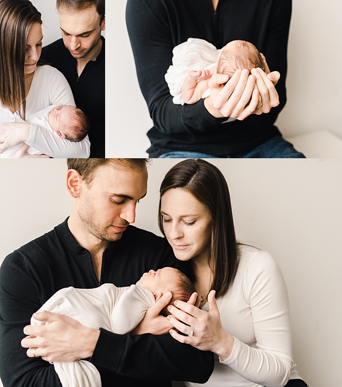 newborn photography columbus ohio mom and dad hold and soothe baby newborn to sleep
