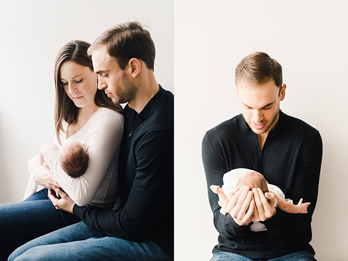 newborn photography columbus ohio mom and dad hold new baby girl in the studio