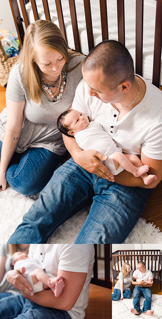 columbus newborn photographer baby girl peacefully looks up at mom and dad