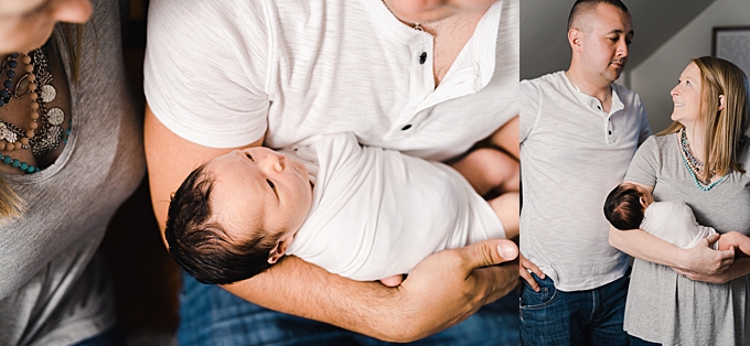 columbus newborn photographer mom and dad hold newborn daughter