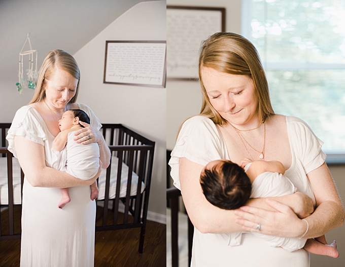 columbus newborn photographer mom holds baby girl in her nursery 