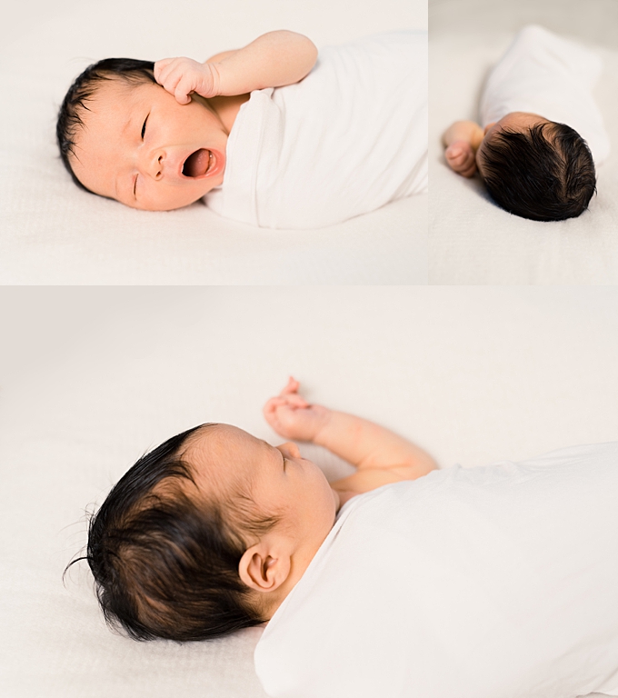 columbus newborn photographer newborn wrapped in white swaddle yawns and sleeps