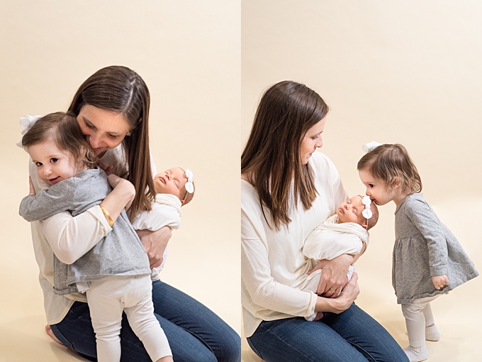 columbus newborn photographer mom snuggles her young daughters