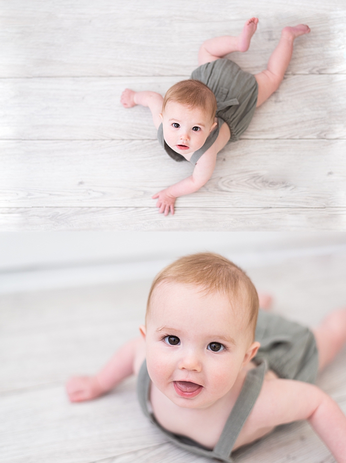 columbus baby photography baby boy with big brown eyes smiles on belly 