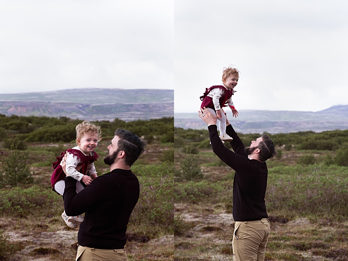 columbus family photographer dad tosses daughter in the air in iceland with mountains in the background