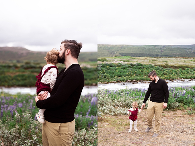 dad kisses daughter and helps her walk in front of lupine and ice blue river in iceland