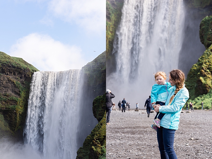 mom holds daughter in front of selfoss waterfall lifestyle family photography 