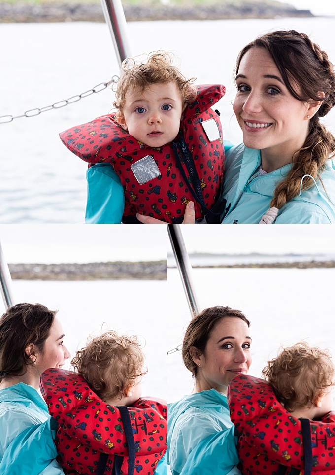 lifestyle family photography mother holds daughter on puffin tour boat