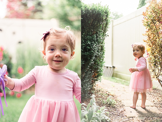 baby photography columbus ohio toddler girl in tutu dress plays with fairy wand in backyard