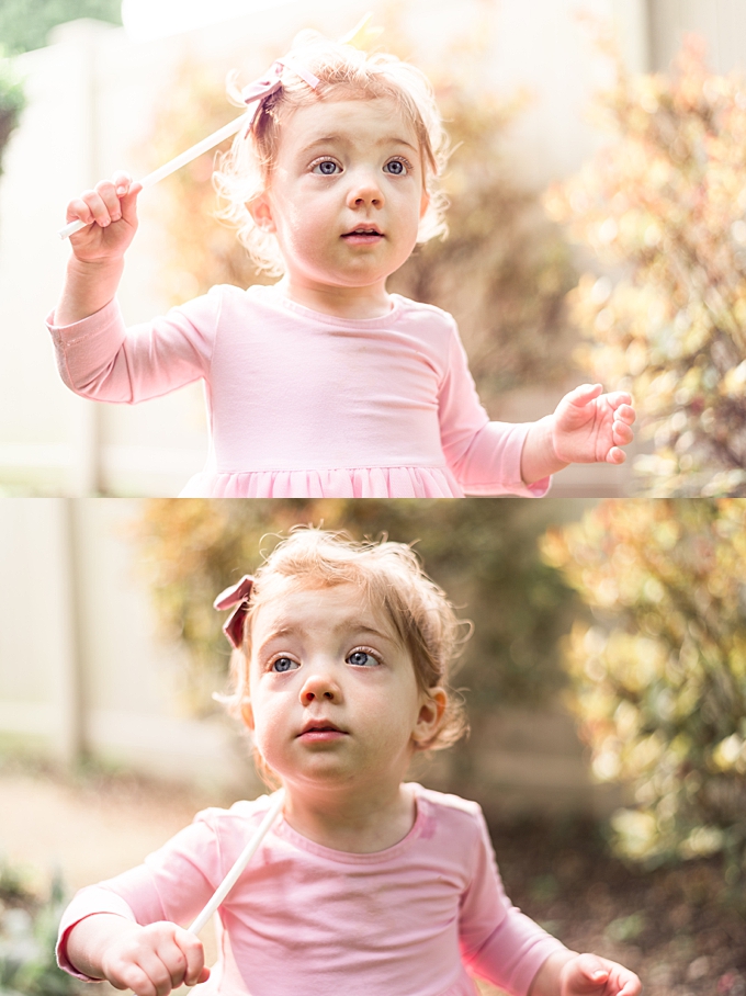 baby with blond hair backlit in backyard