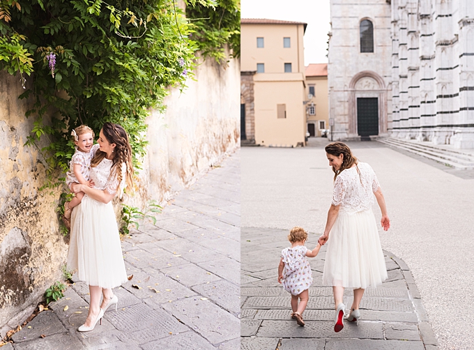 destination family photos mom snuggles toddler daughter in tuscan square in front of wisteria