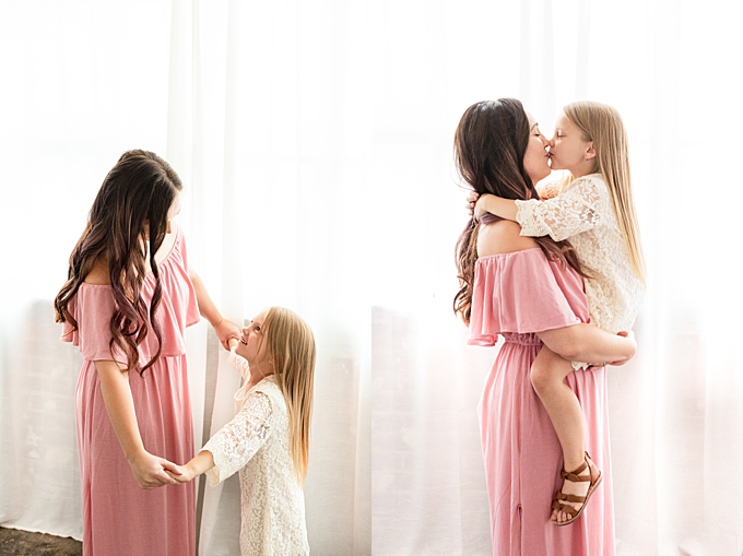 central ohio family photographer mom dances and kisses her daughter in studio