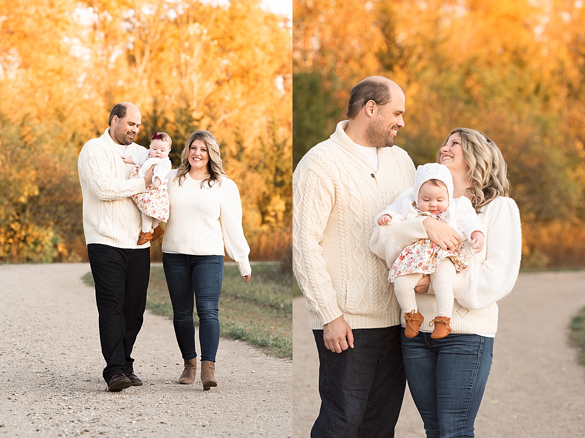 columbus lifestyle family photographer mom, dad and daughter walk outside with fall leaves