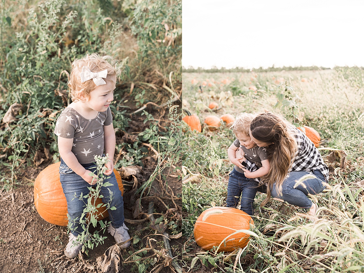 Columbus Lifestyle Family Photographer mom snuggles and hugs daughter in pumpkin patch