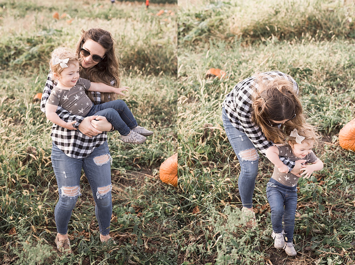 Columbus Lifestyle Family Photographer mom holds and chases after toddler in pumpkin patch