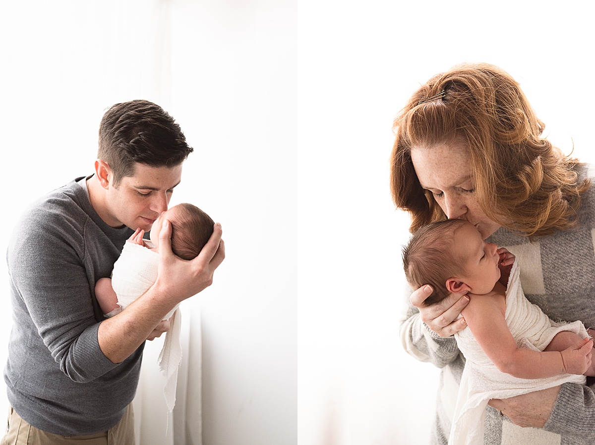 photography newborn mom kisses newborn boy