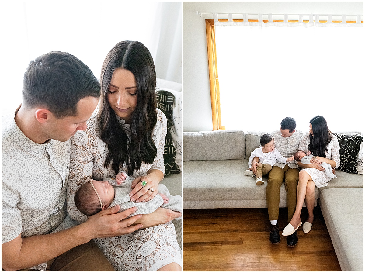lifestyle newborn photography new family of four sits on the couch