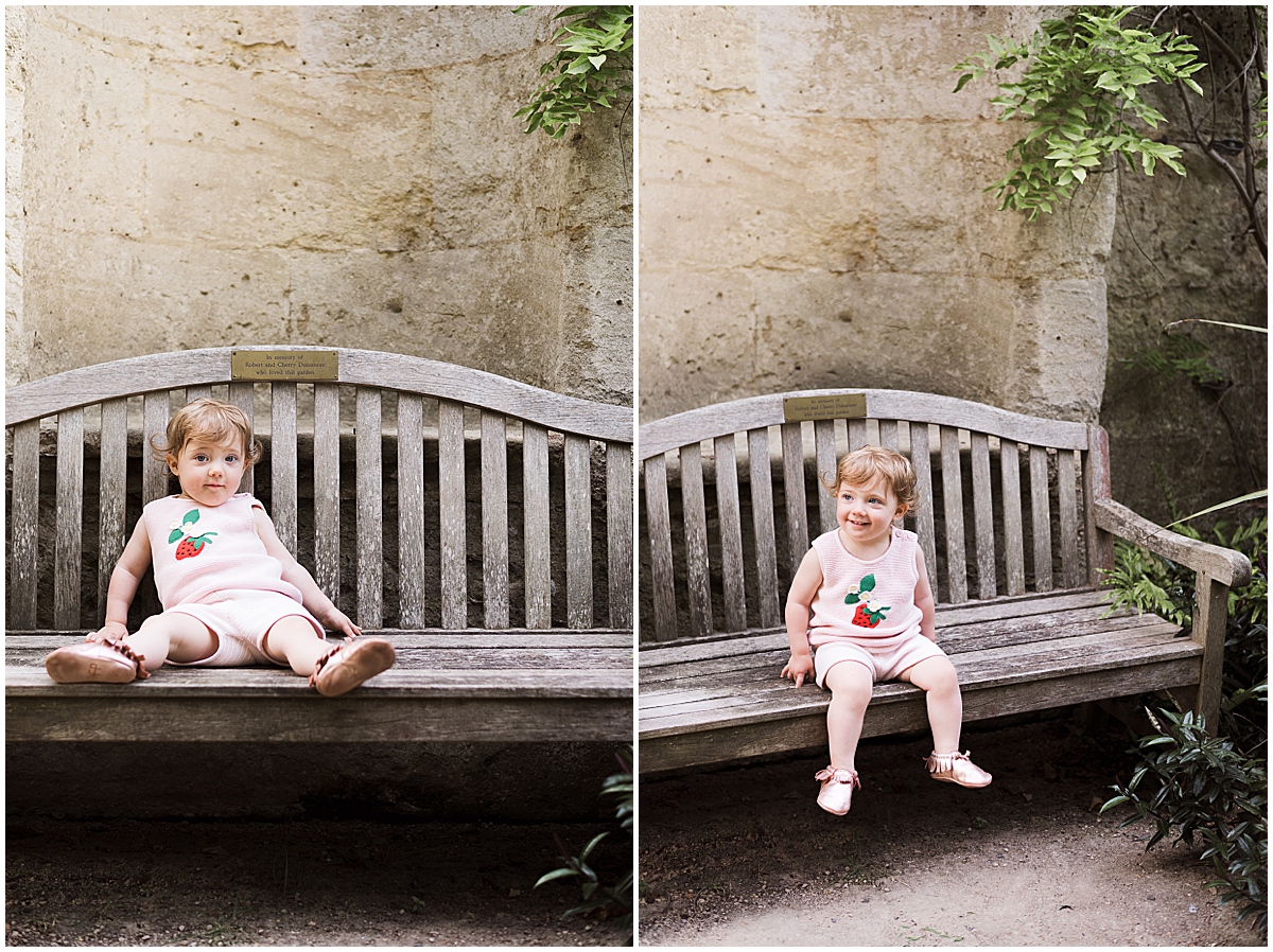 europe travel photographer little girl sits on bench 