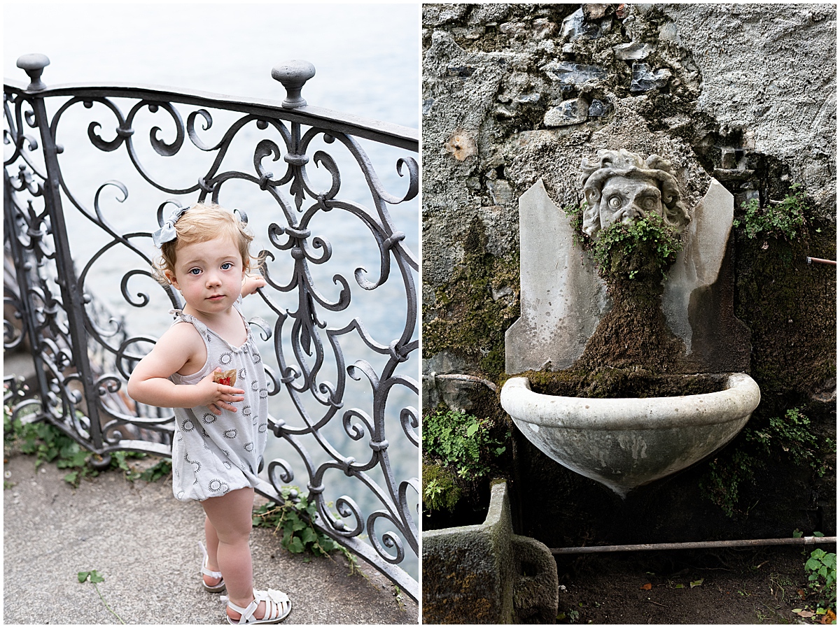 lifestyle travel photographer toddler looks out at Lake Como from behind wrought iron gate
