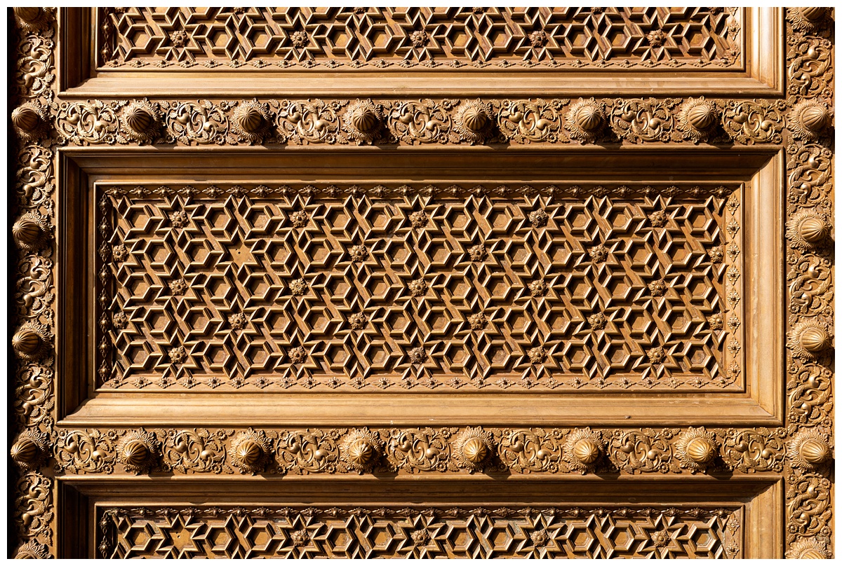 ornate gold doors with geometric pattern