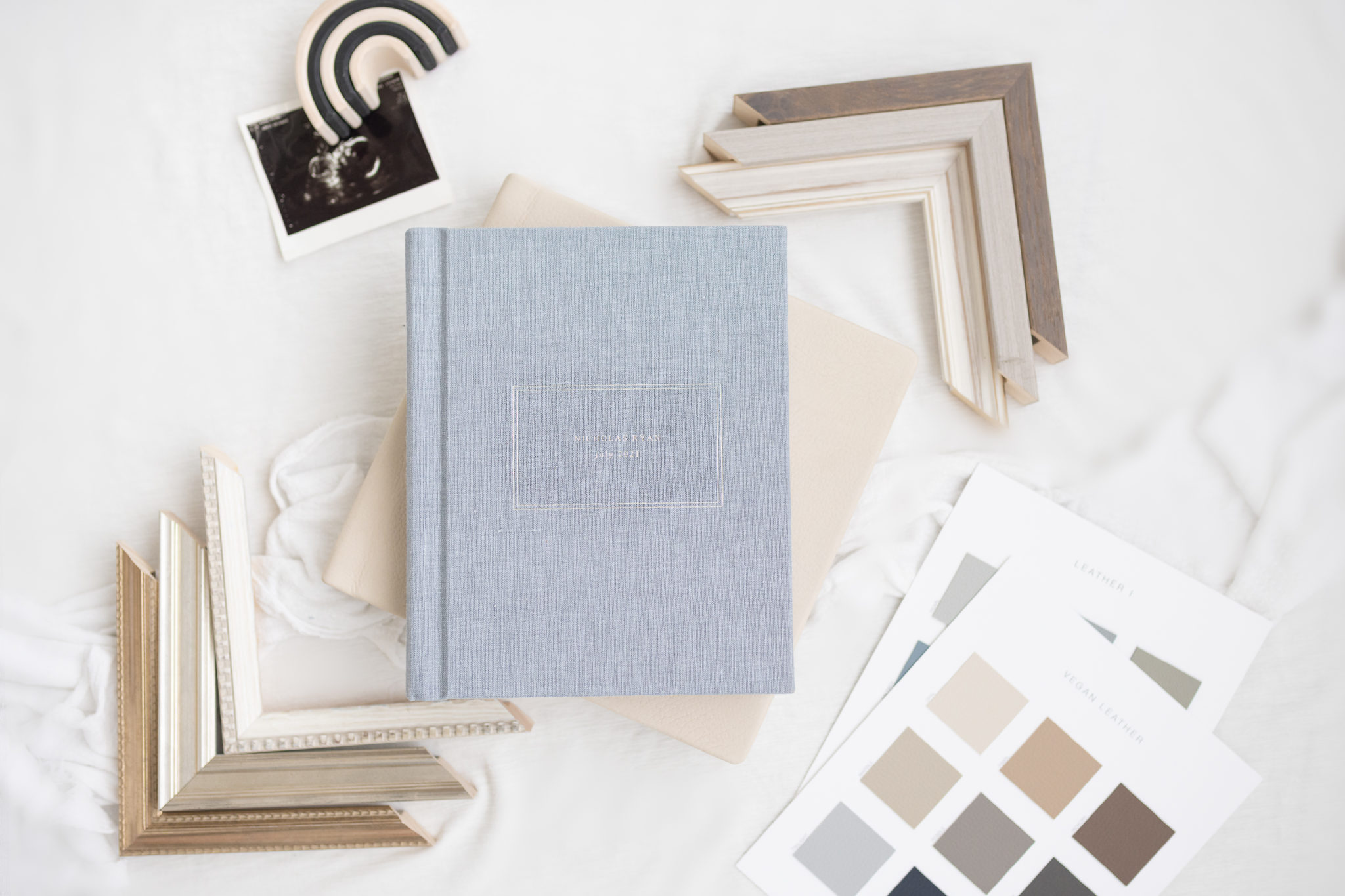 blue linen album with silver debossing and frame corners