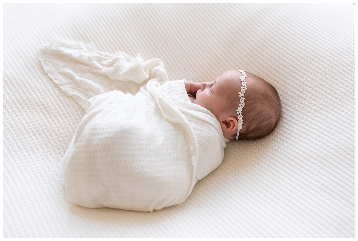 top newborn photographer columbus oh studio newborn wears lace headband