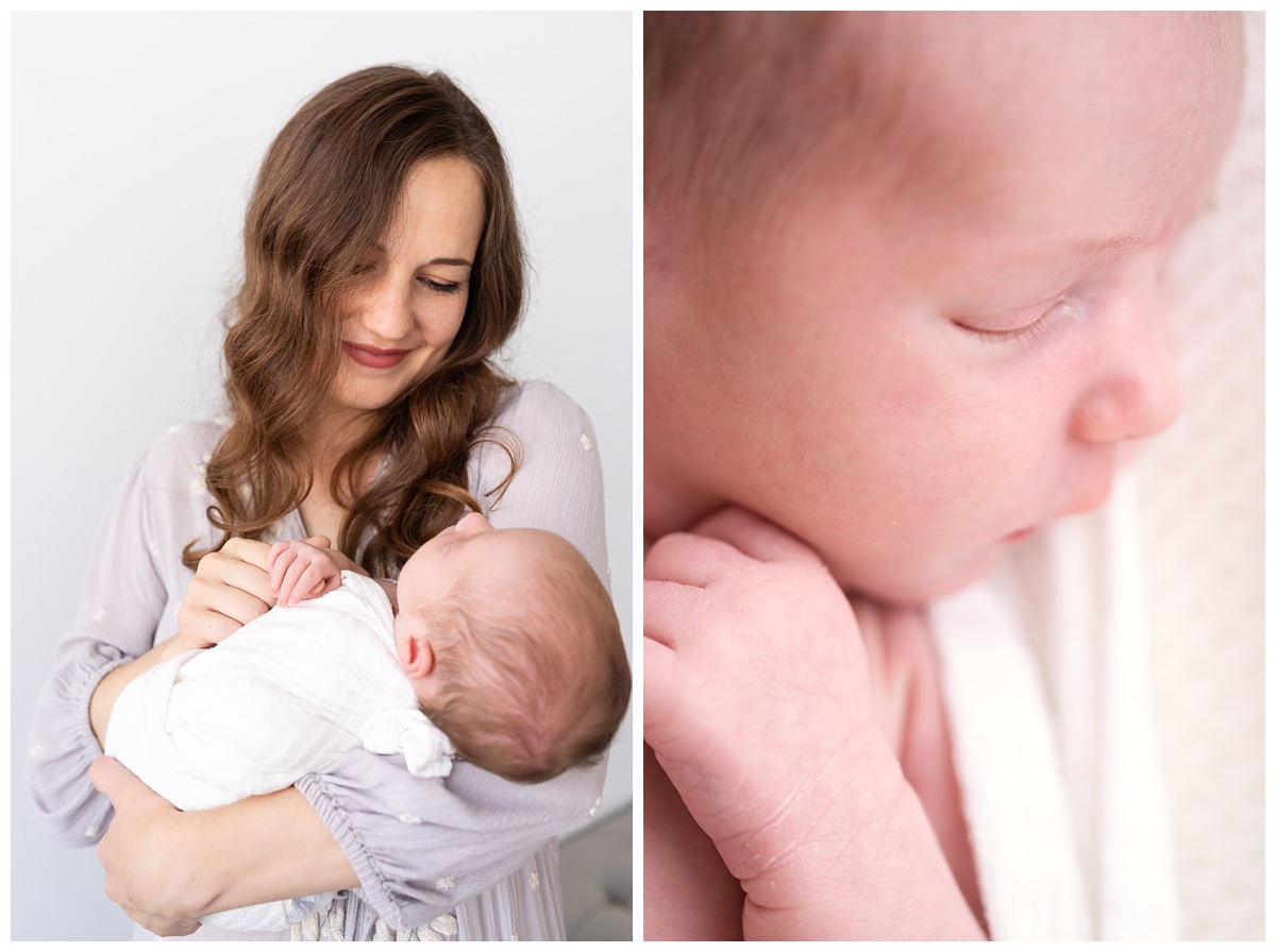 mom rocks newborn girl in to newborn photographers studio in columbus oh