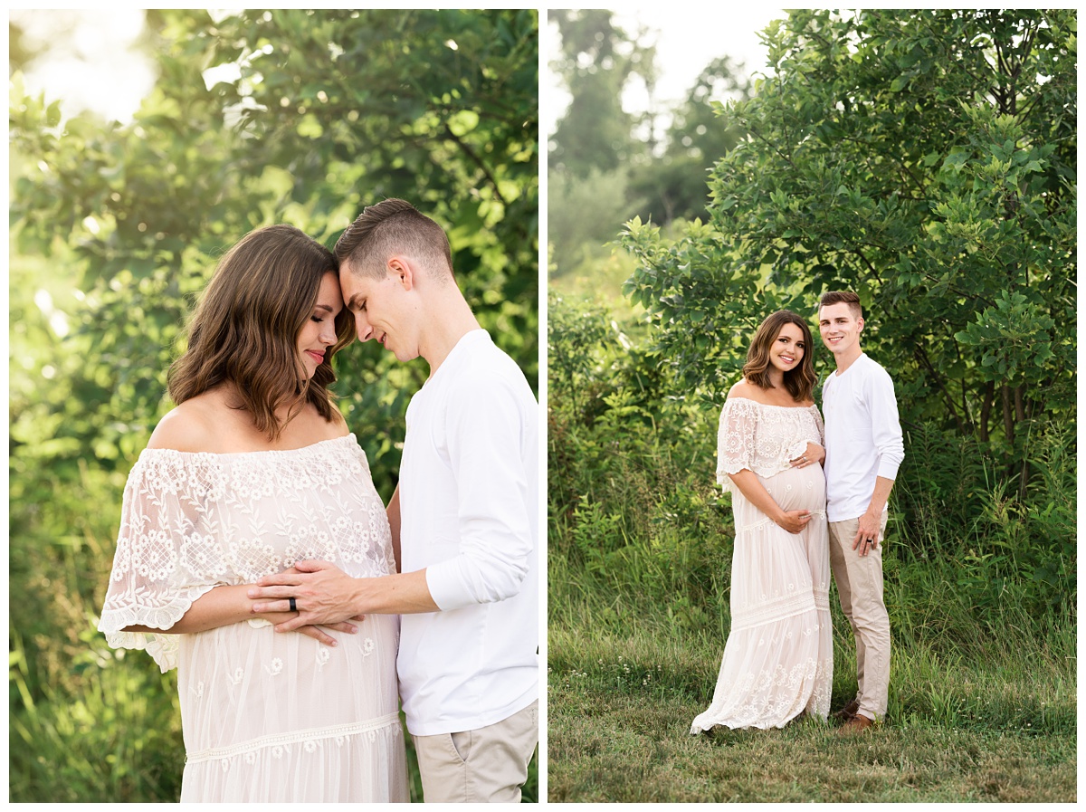 pregnant mom in boho dress and husband touch heads in field