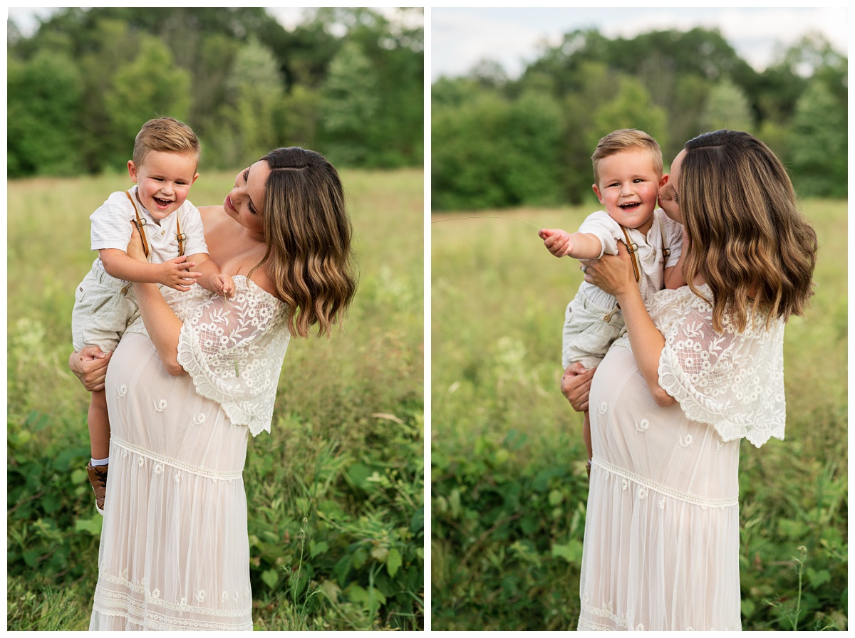 mom and toddler cuddle and kiss during field maternity session columbus