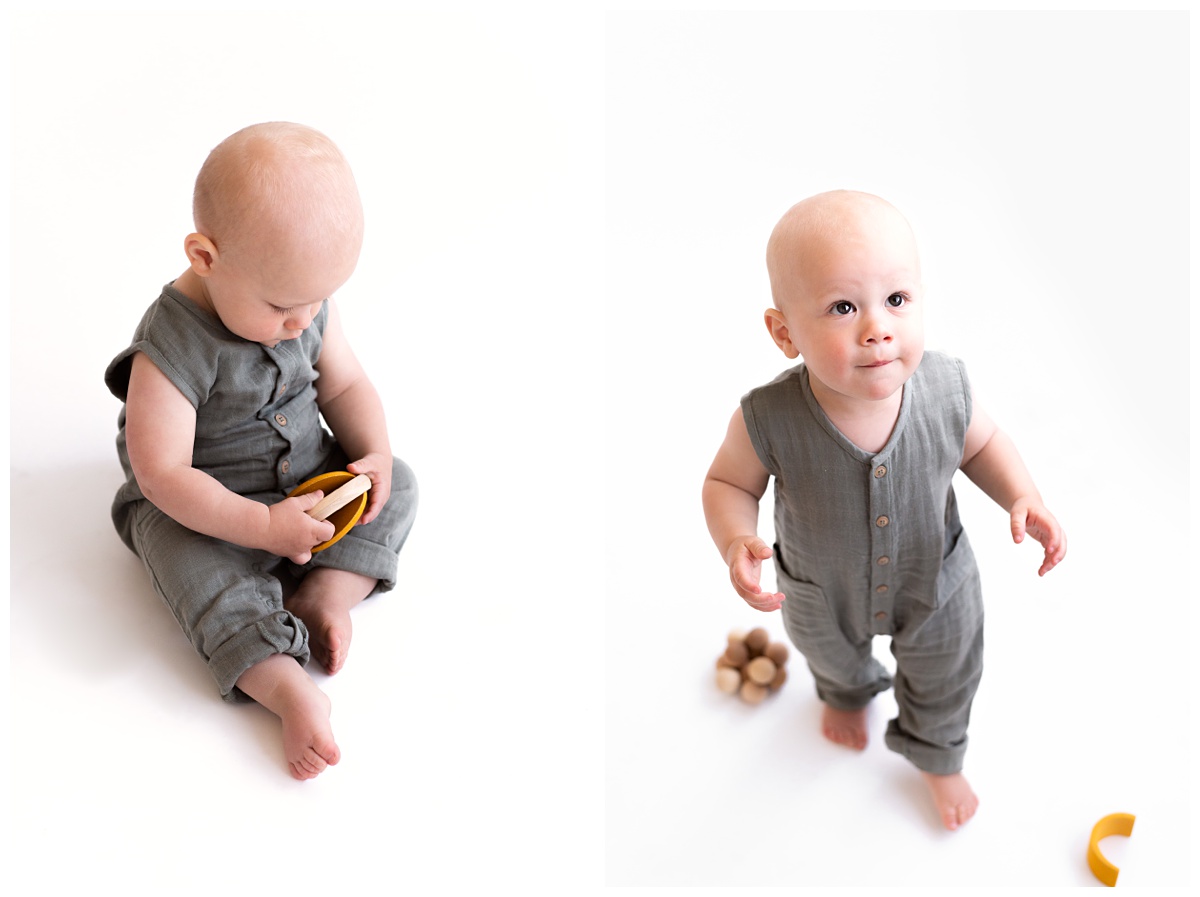 toddler boy plays with wooden toys in studio