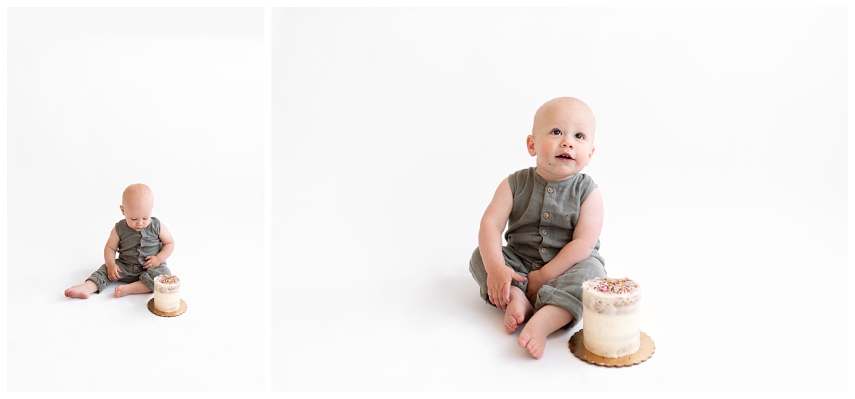 studio cake smash simple white backdrop with boy in hunter green and white cake