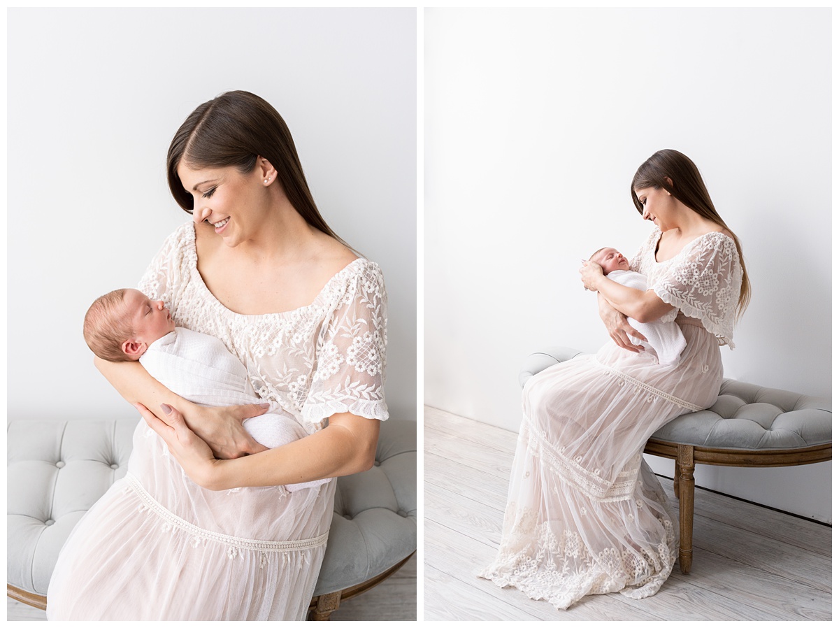 mom caresses son's head in studio newborn session columbus