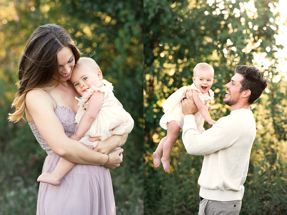 award winning columbus family photographer mom and dad hold toddler in blush dress