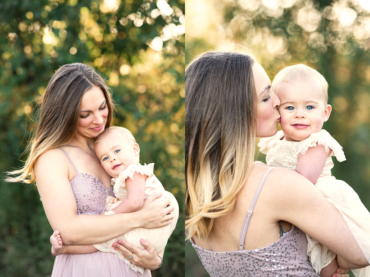 award winning columbus family photographer mom in purple dress holds one year old