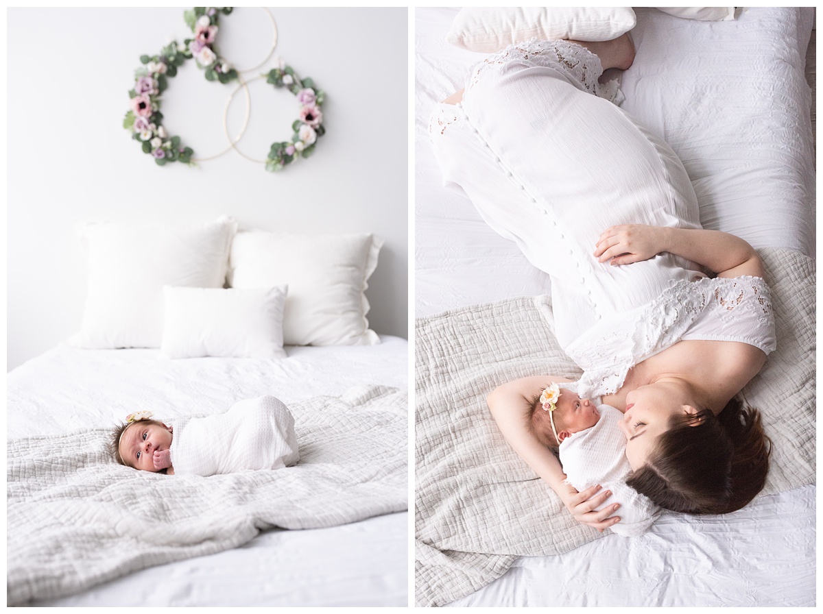 Lifestyle Newborn Photographer Columbus Ohio mom cradles newborn on white bed