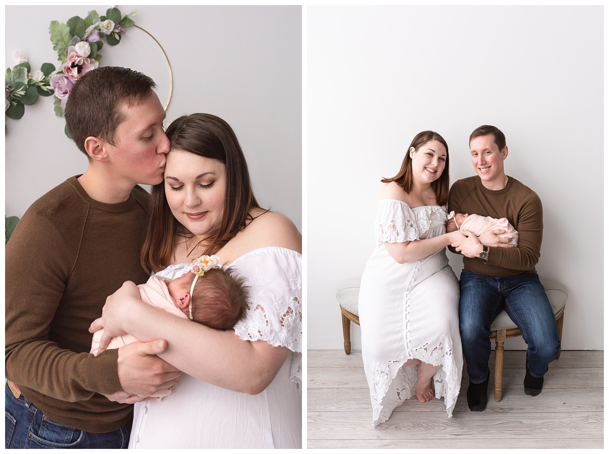 Lifestyle Newborn Photographer Columbus Ohio mom and dad hold newborn girl in studio