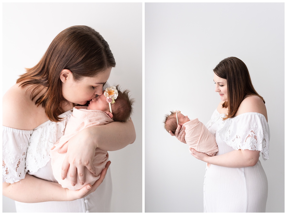 Lifestyle Newborn Photographer Columbus Ohio mom smiles and kisses newborn girl