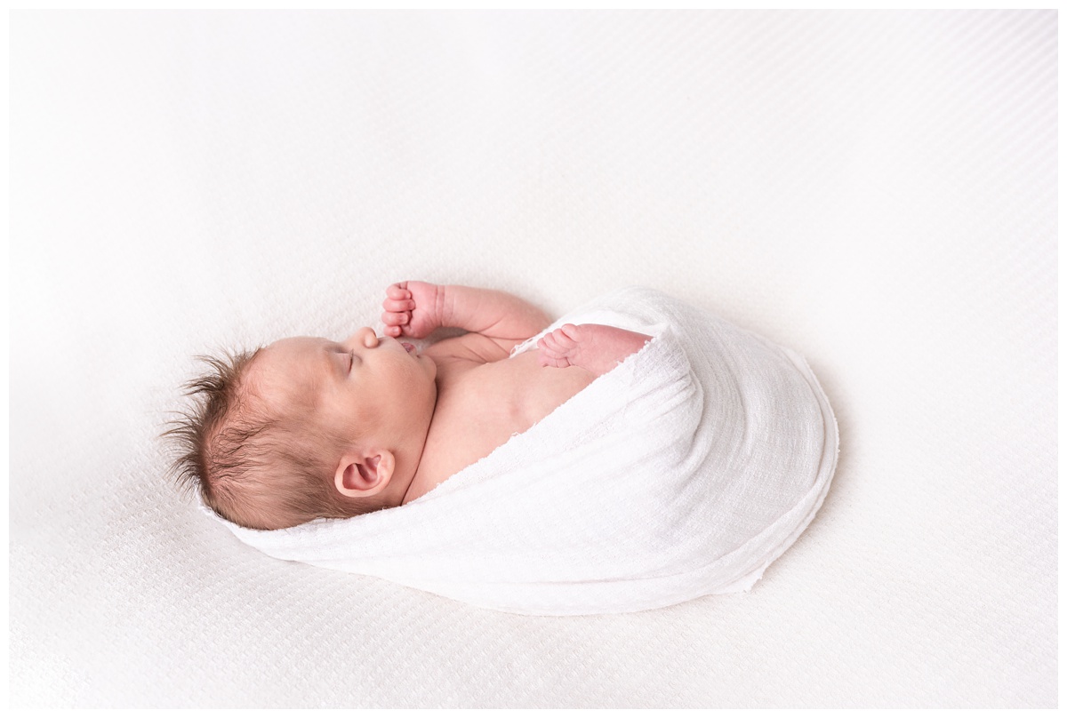 Lifestyle Newborn Photographer Columbus Ohio profile of sleeping newborn in studio