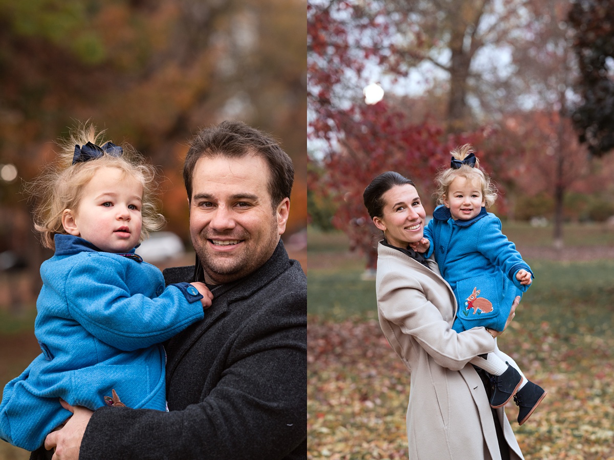 Lifestyle Family Photographer Columbus mom and dad hold toddler girl in schiller park
