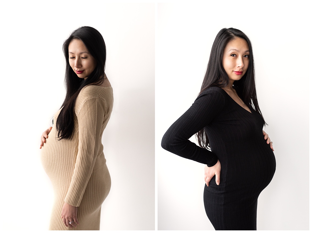 classic studio maternity columbus oh woman places hand on belly in tan and black dress with white background 