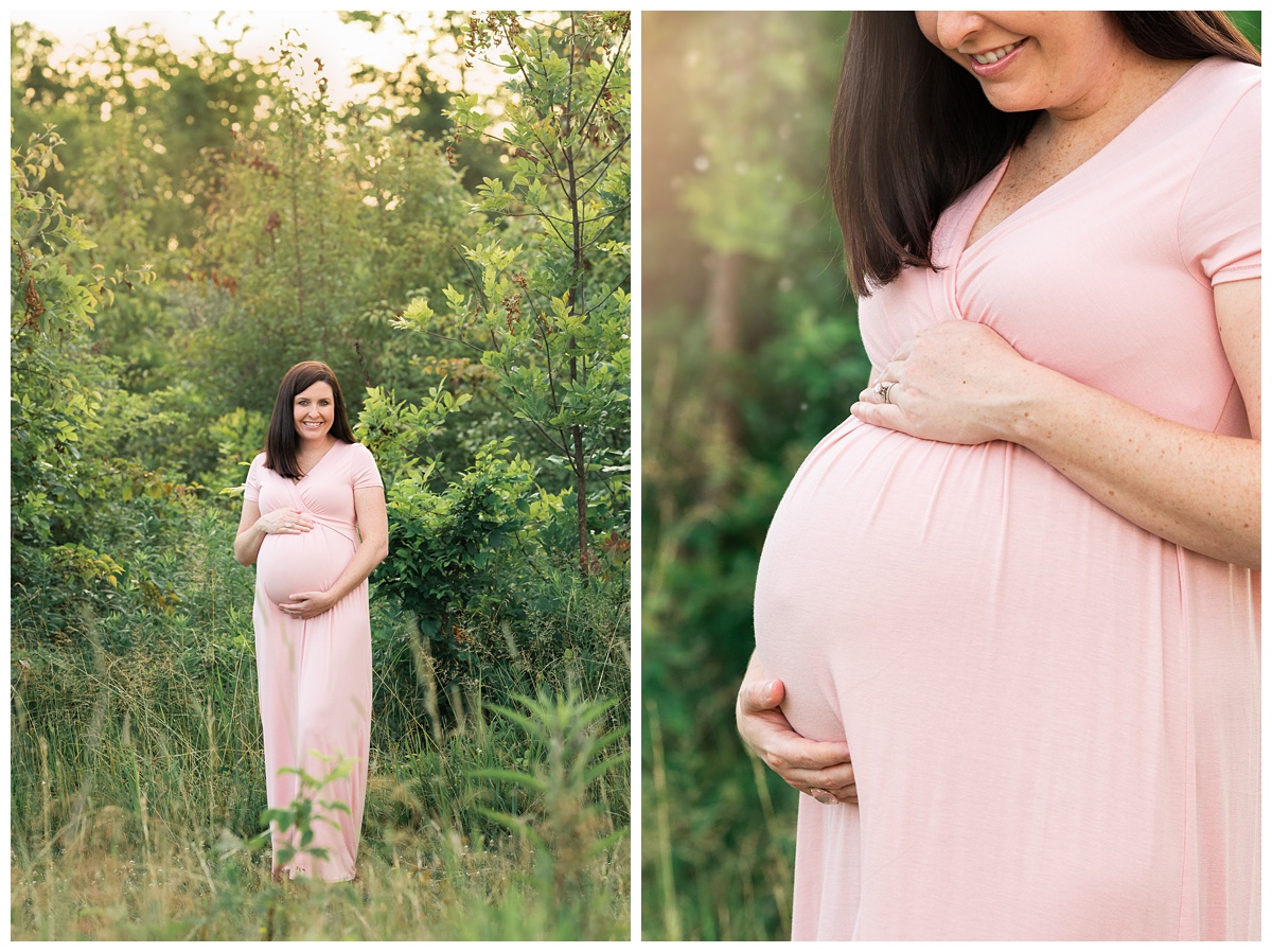 best maternity photographer mom in long light pink dress holds belly and smiles in golden light at sunset