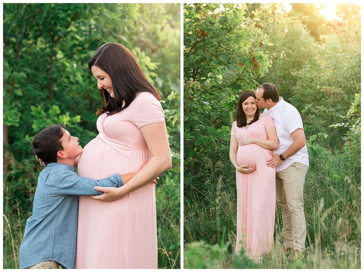 best maternity photographer mom is hugged by son in blue shirt and husband in white shirt with warm hazy light