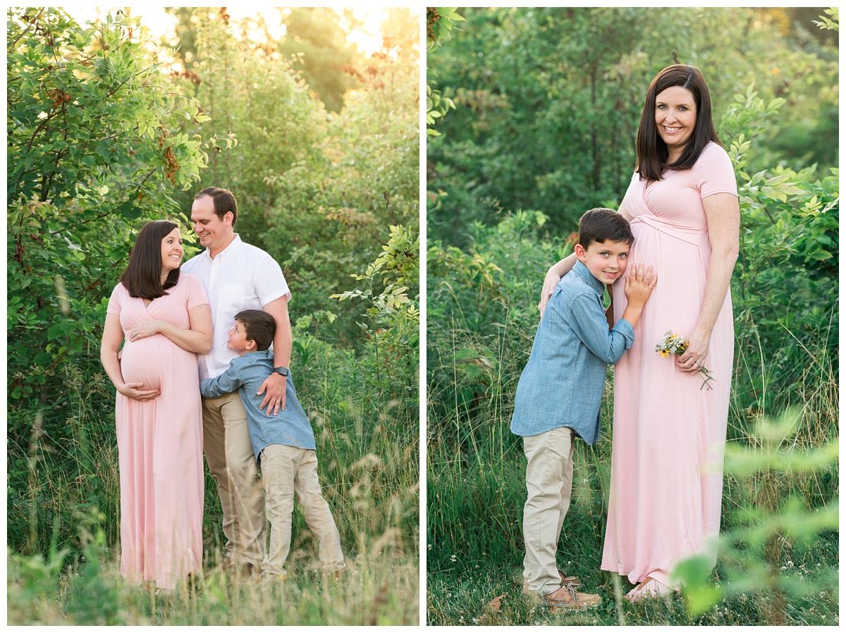 best maternity photographer family of three snuggle, mom holds young son as he hugs her belly