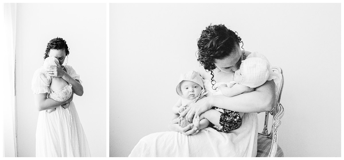 Professional Baby Photographer Columbus Ohio black and white images of mom holding her two twin babies with bonnets on seated in chair