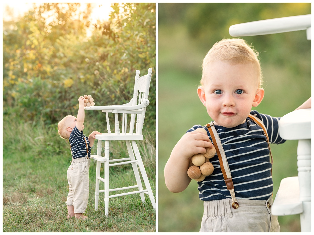 baby boy plays outside at sunset wearing suspenders and blue striped shirt